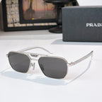 Prada sunglasses with dark lenses and silver-tone frame, butterfly shape