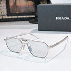 Prada eyeglasses with clear frame and light lenses, rectangular round shape