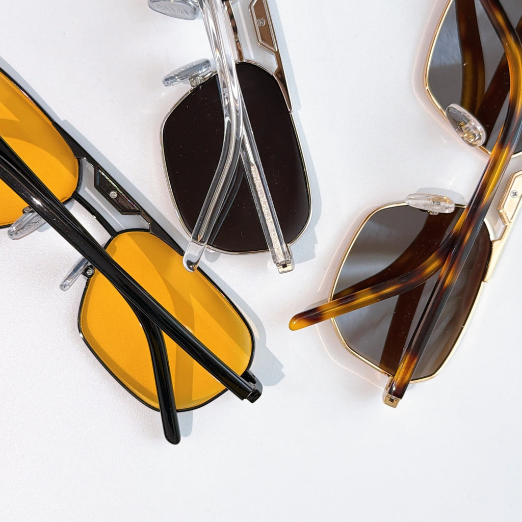 Prada sunglasses set with yellow and black lenses, mixed frame colors