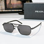Prada sunglasses with dark gray lenses and black frame, cat-eye style