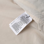 Off-white jacket care label tag inside collar