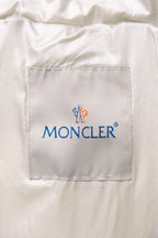 Moncler logo label on white puffer jacket chest pocket