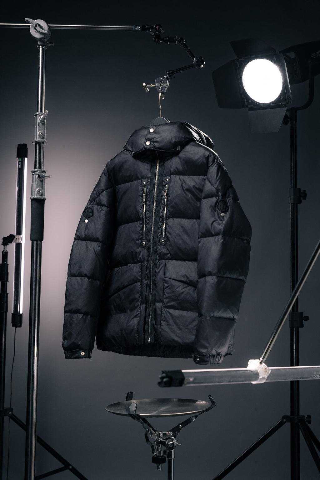 Long Moncler puffer jacket with hood, dark fabric, full-zip front