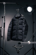 Long Moncler puffer jacket with hood, dark fabric, full-zip front