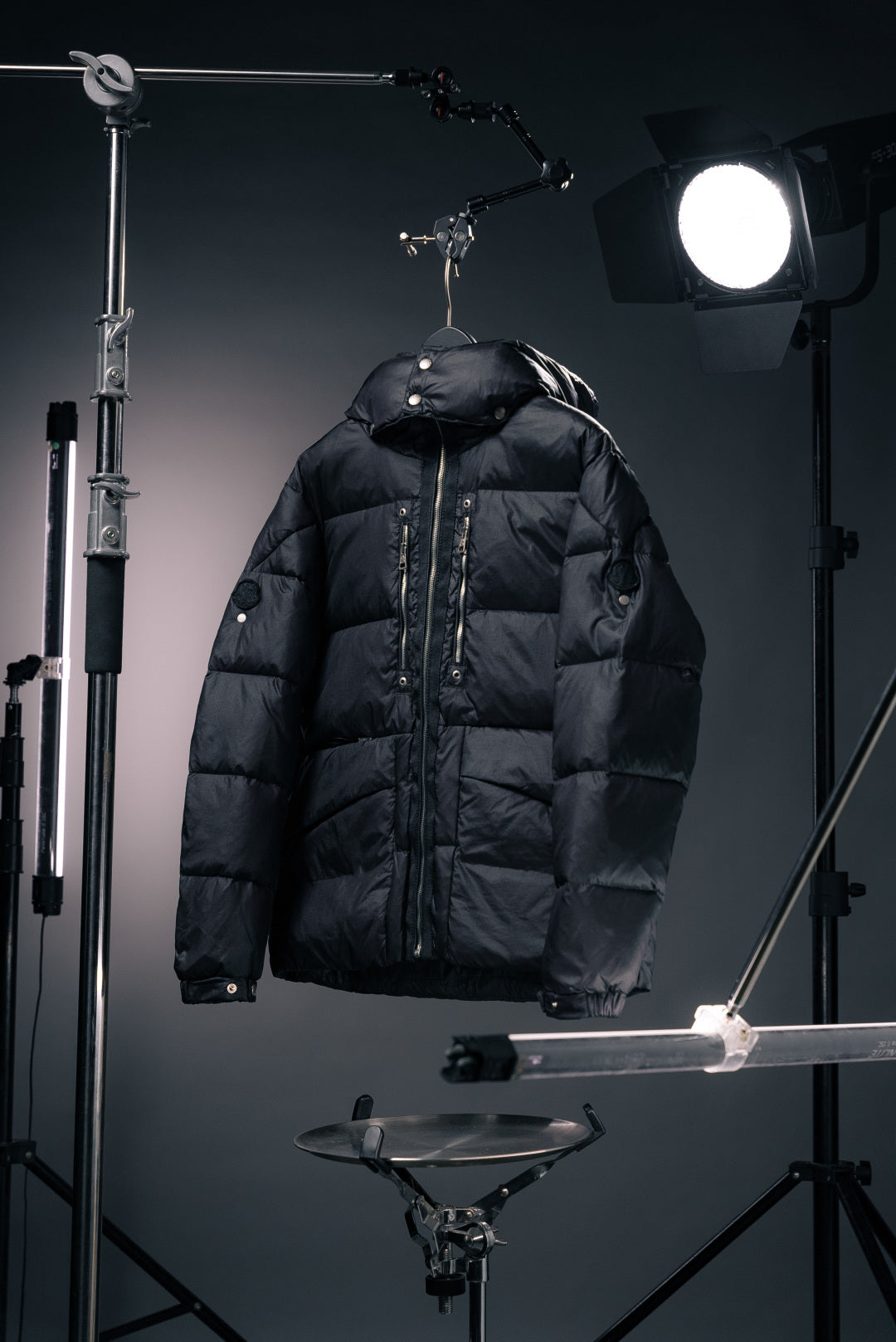 Long Moncler puffer jacket with hood, dark fabric, full-zip front