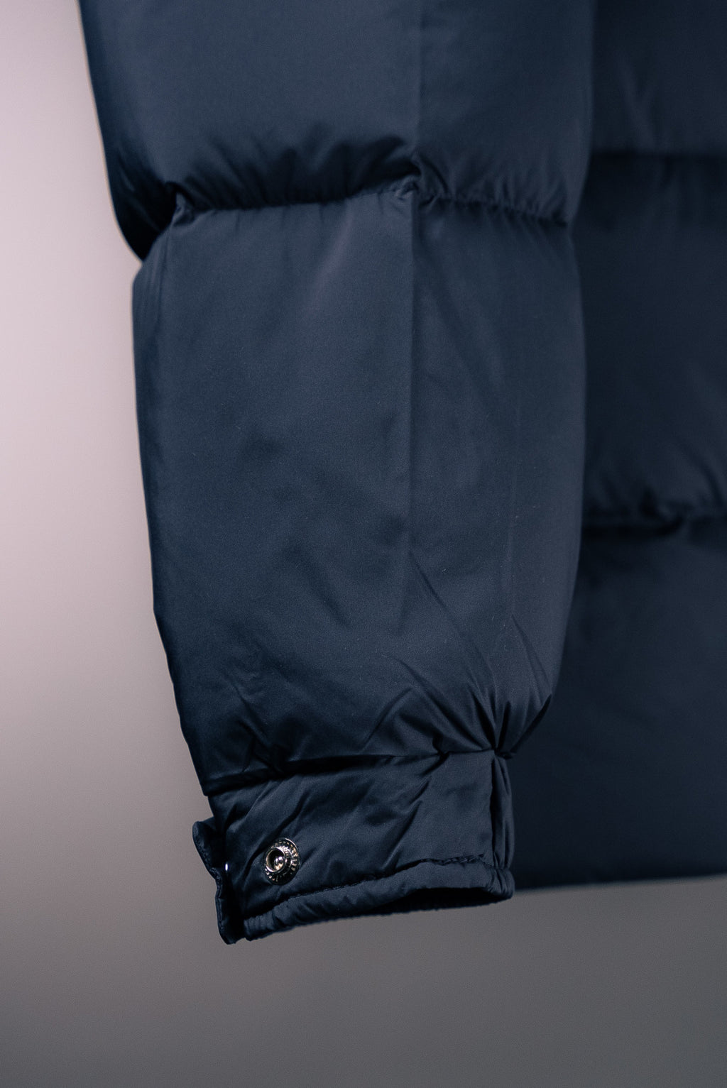 Moncler long puffer jacket hem with drawstring and elastic cuff