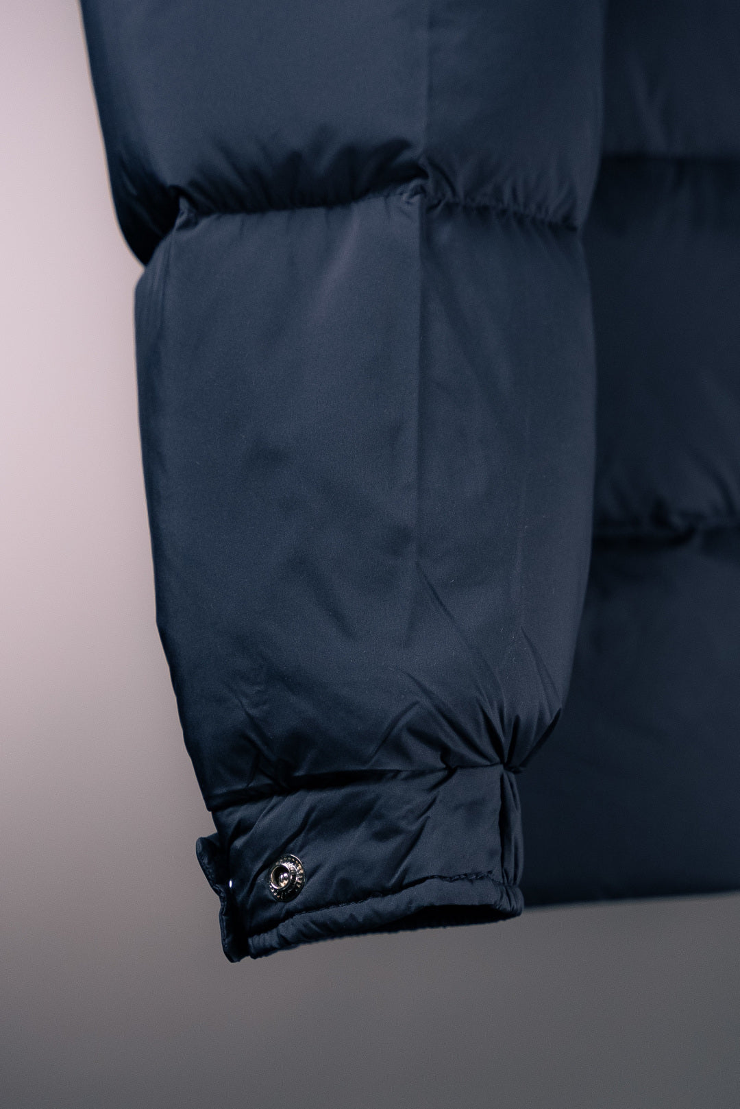Moncler long puffer jacket hem with drawstring and elastic cuff
