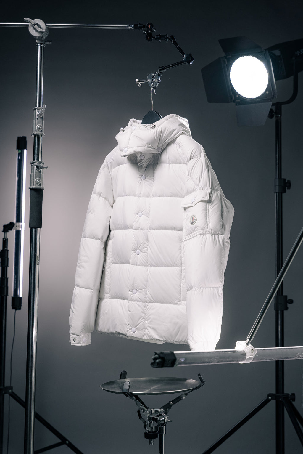 White hooded long puffer jacket with front zip and quilted panels