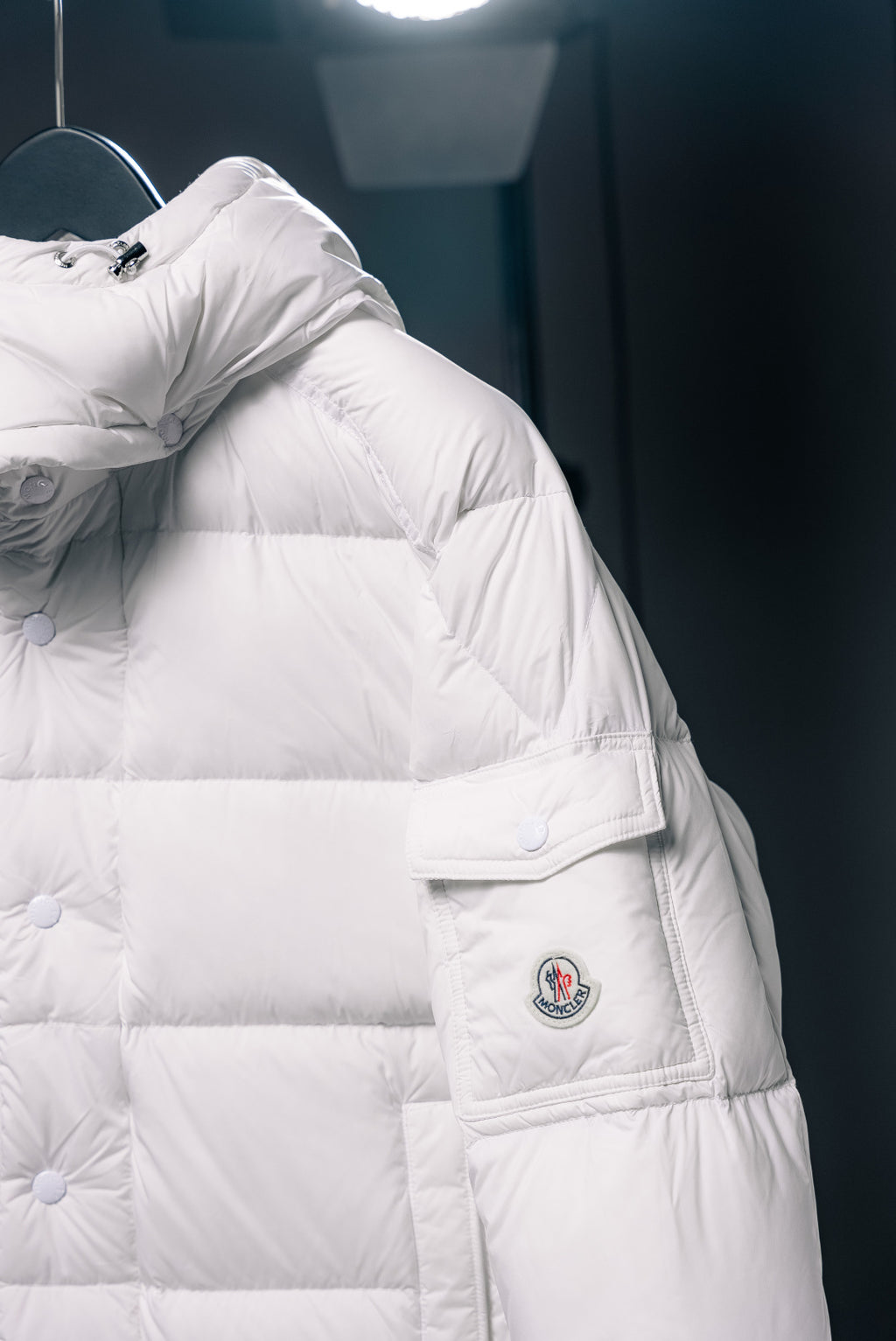 White puffer jacket with chest flap pocket and Moncler logo patch