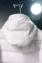 White puffer jacket hood with high collar and quilted shoulder panels