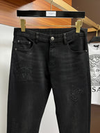 Black Versace jeans with front button and embossed logo patch detail