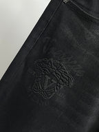 Black Versace jeans with embroidered side logo on the leg