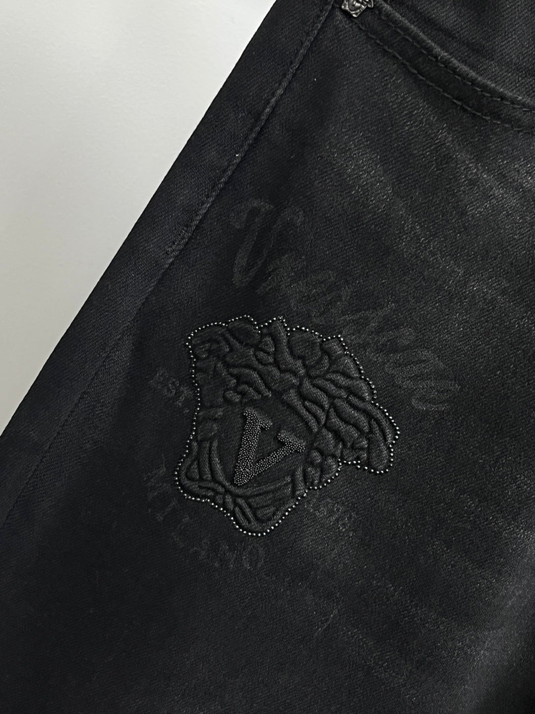 Black Versace jeans with embroidered side logo on the leg