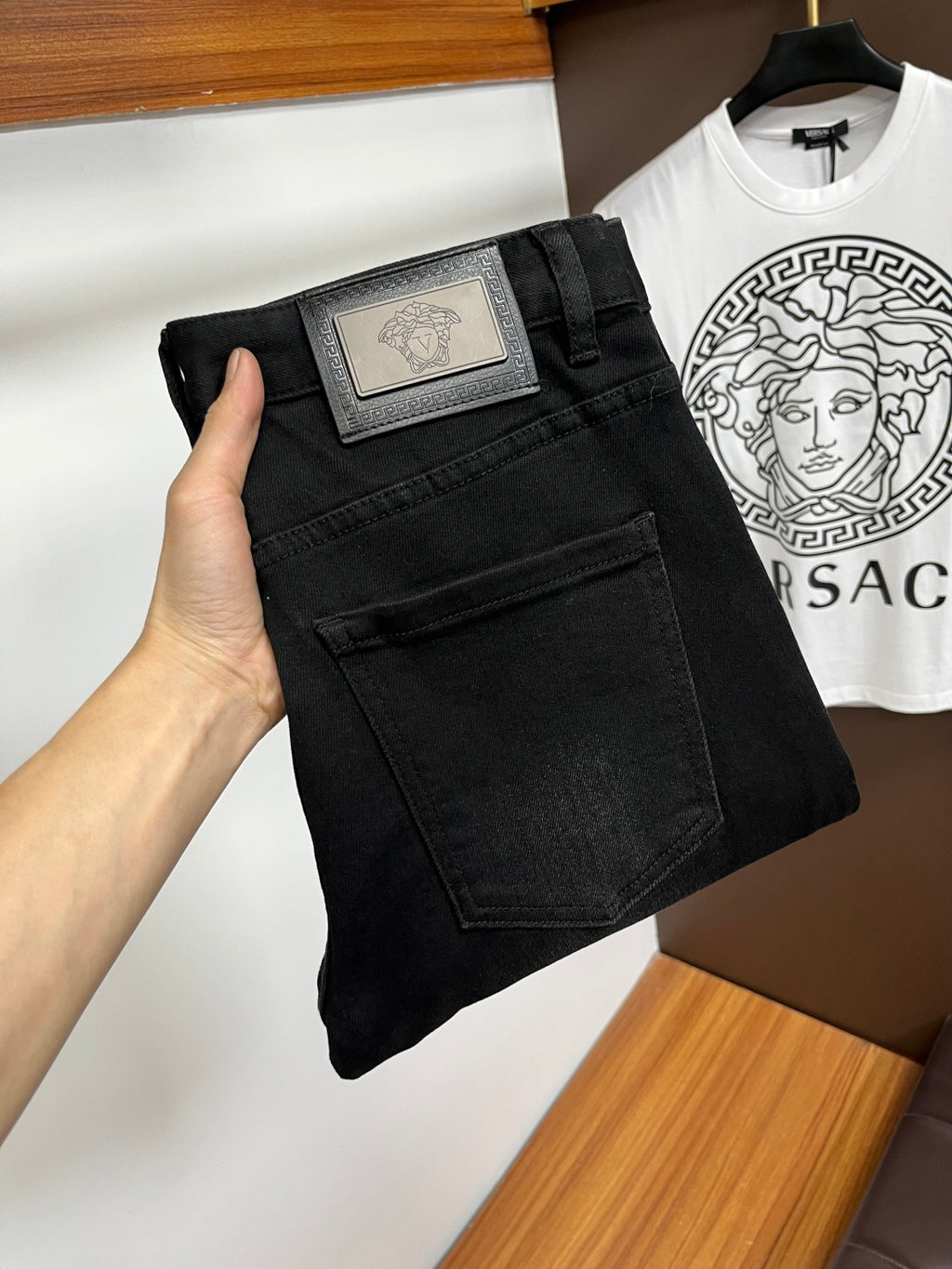 Black Versace jeans with label patch and dark front pockets detail