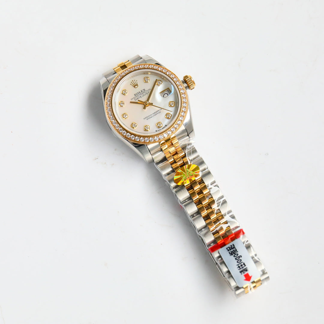 Two-tone wristwatch with white dial, diamond bezel, and gold-and-steel bracelet
