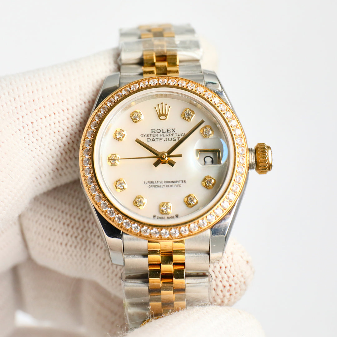 Rolex Datejust wristwatch with white dial, gold hour markers, diamond bezel, jubilee band