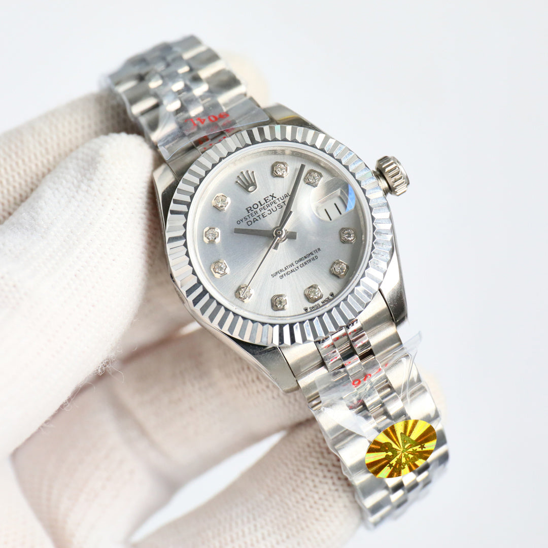 Wristwatch with silver dial and gem indexes, steel bracelet, crown on right