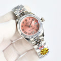 Rolex wristwatch with pink dial, silver bezel, and steel bracelet in close view