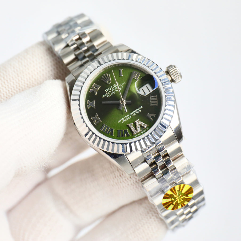 Wristwatch with green dial, silver bezel, and steel bracelet, crown on right