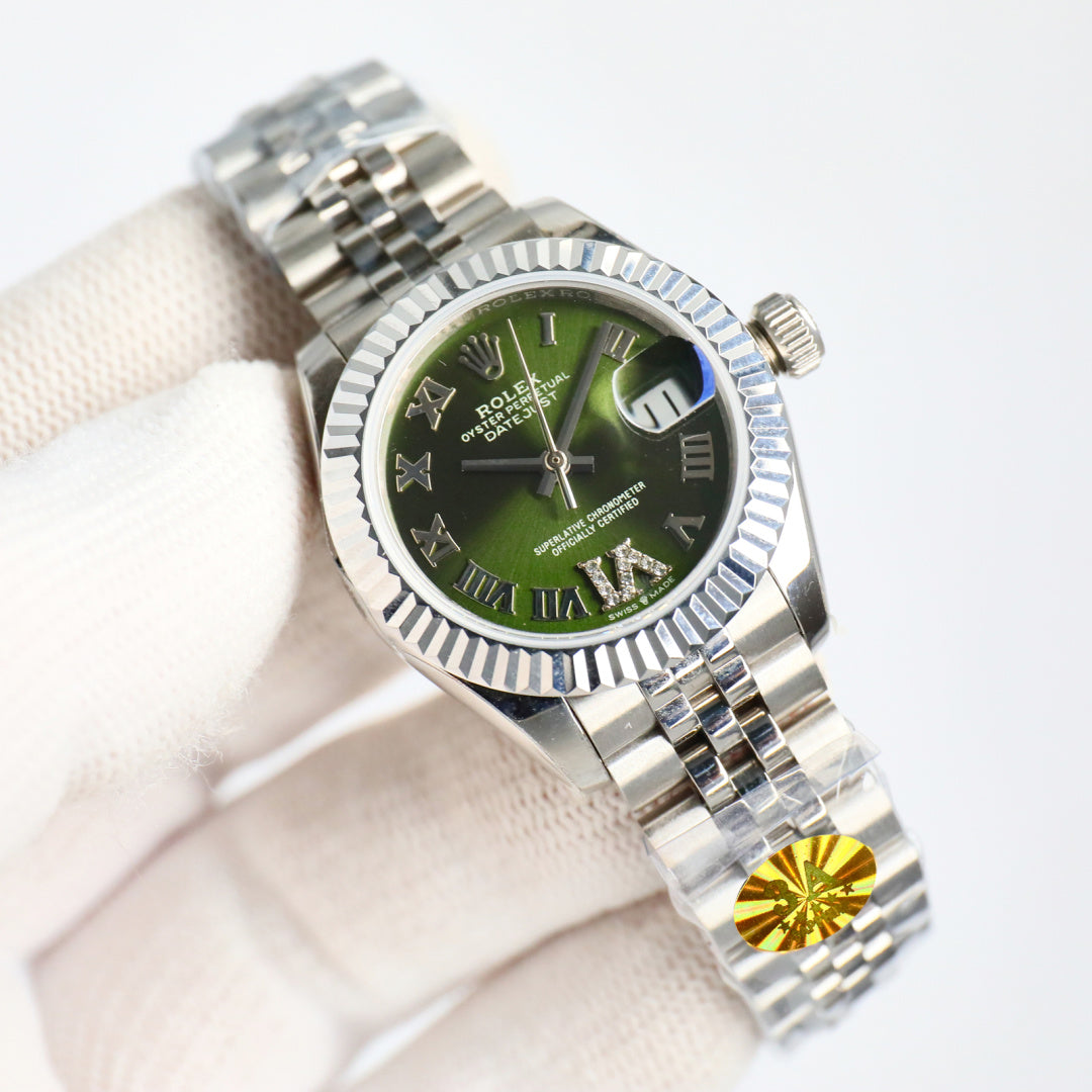 Wristwatch with green dial, silver bezel, and steel bracelet, crown on right