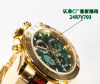Rolex wristwatch close-up with green dial and gold bezel