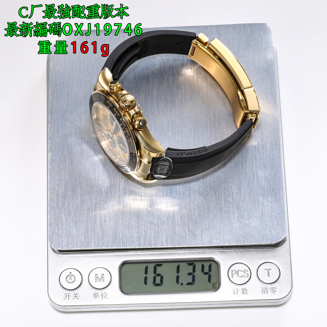 Rolex wristwatch on a digital scale, gold-tone case with black rubber strap.