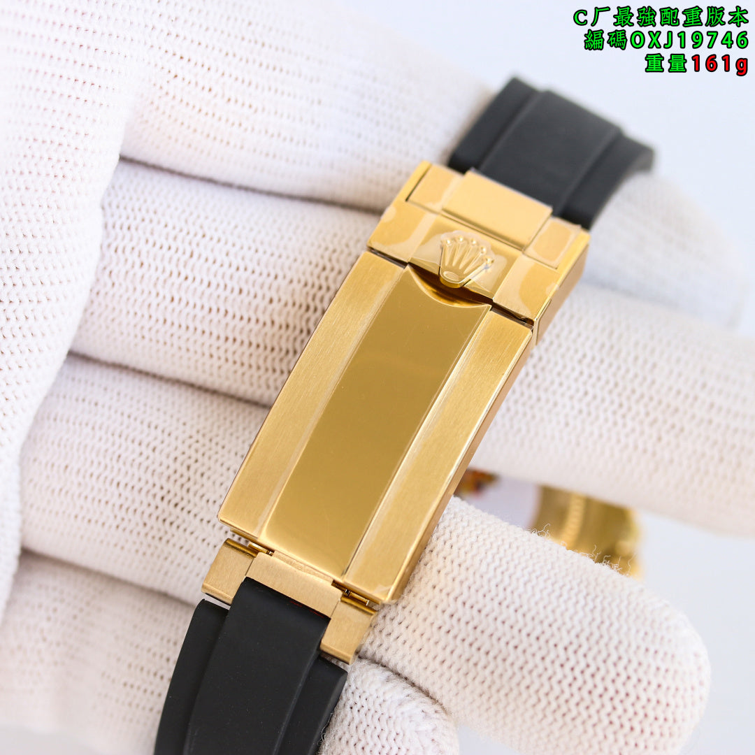 Rolex wristwatch clasp view with gold-tone buckle and black rubber strap.