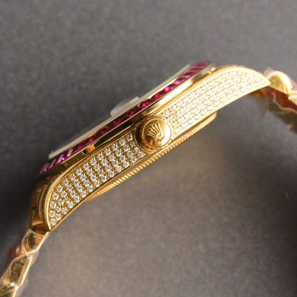 Rolex jeweled gold watch case with pink bezel and diamond bracelet links