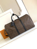 Louis Vuitton monogram duffel bag with black top handles and leather trim