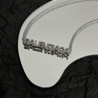 Silver Balenciaga logo pendant necklace with rhinestone-like letters