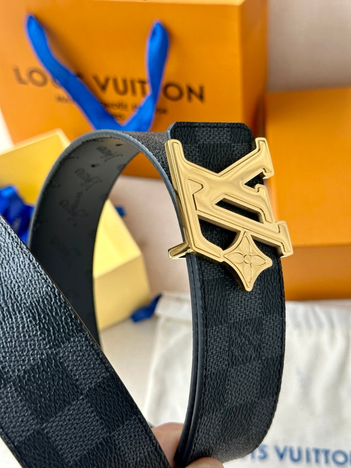 Close-up dark leather belt with gold-toned LV buckle and textured strap grain.