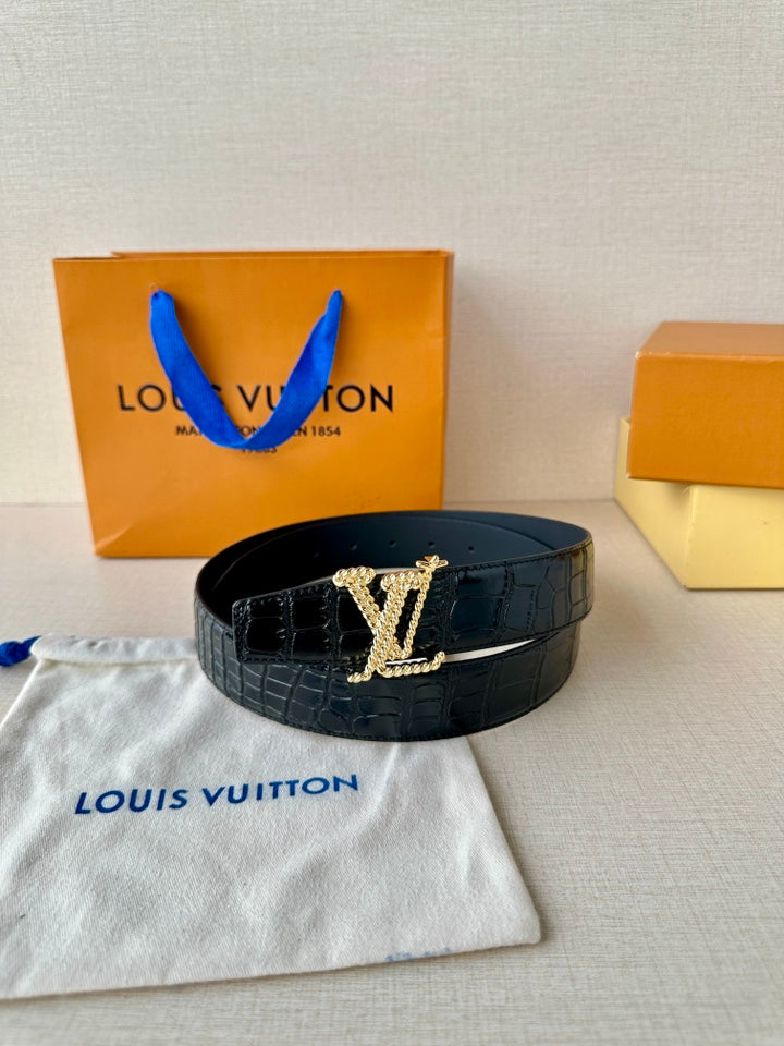 Dark blue croc leather belt with gold-tone LV buckle, styled on a pouch