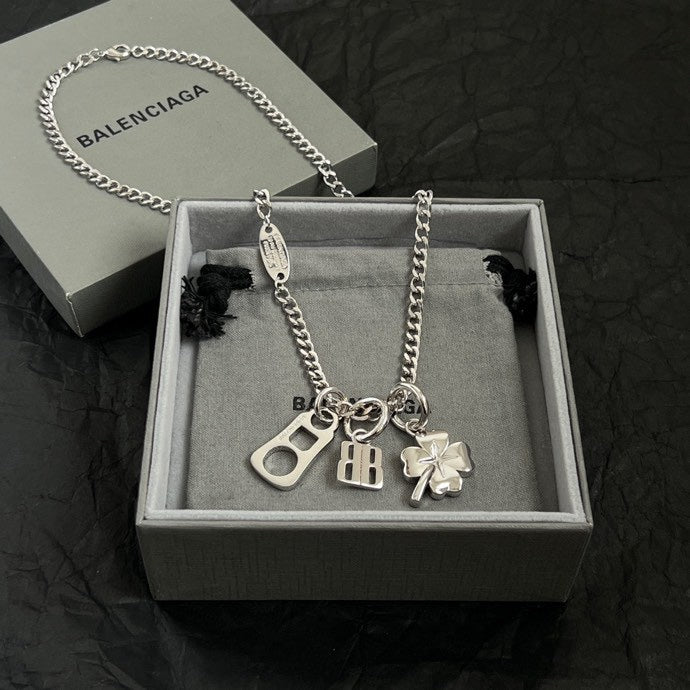 Balenciaga silver pendant necklace with clover and BB charms in gift box