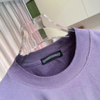 Lavender crewneck T-shirt collar with black neck label and seam details