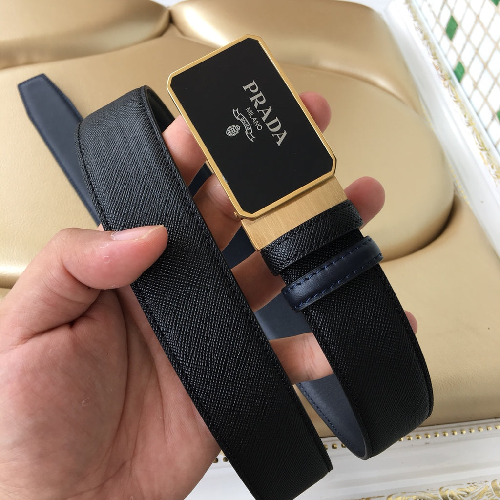 Prada belt with black textured strap and gold-toned rectangular logo buckle
