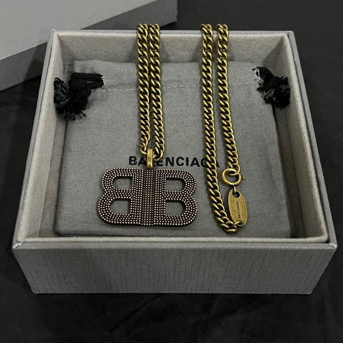 Balenciaga BB logo pendant necklace set with gold chains and charms in box