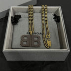 Balenciaga BB logo pendant necklace set with gold chains and charms in box