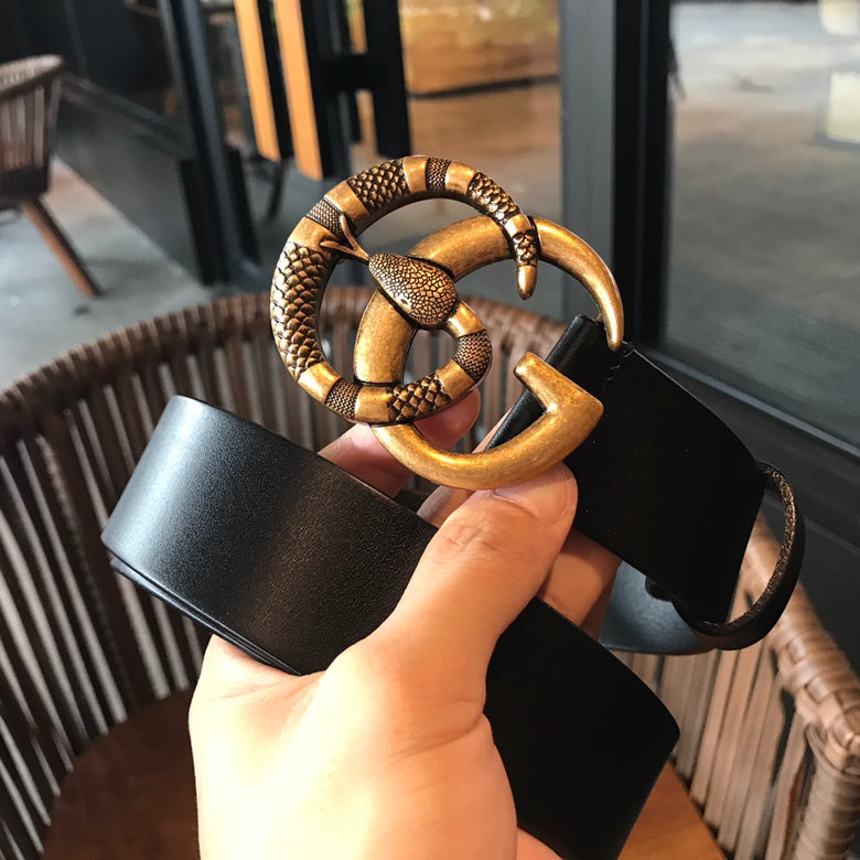 Black leather belt with gold-tone buckle loop and ring detail
