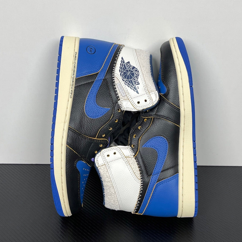 High-top sneakers with white and blue strap detail, black leather upper, cream midsole