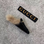 Black velvet loafer slide with beige faux fur trim and gold-tone ring hardware