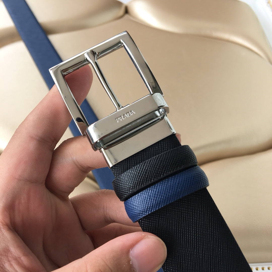 Prada logo on silver buckle of two-tone belt, textured black strap with blue edge