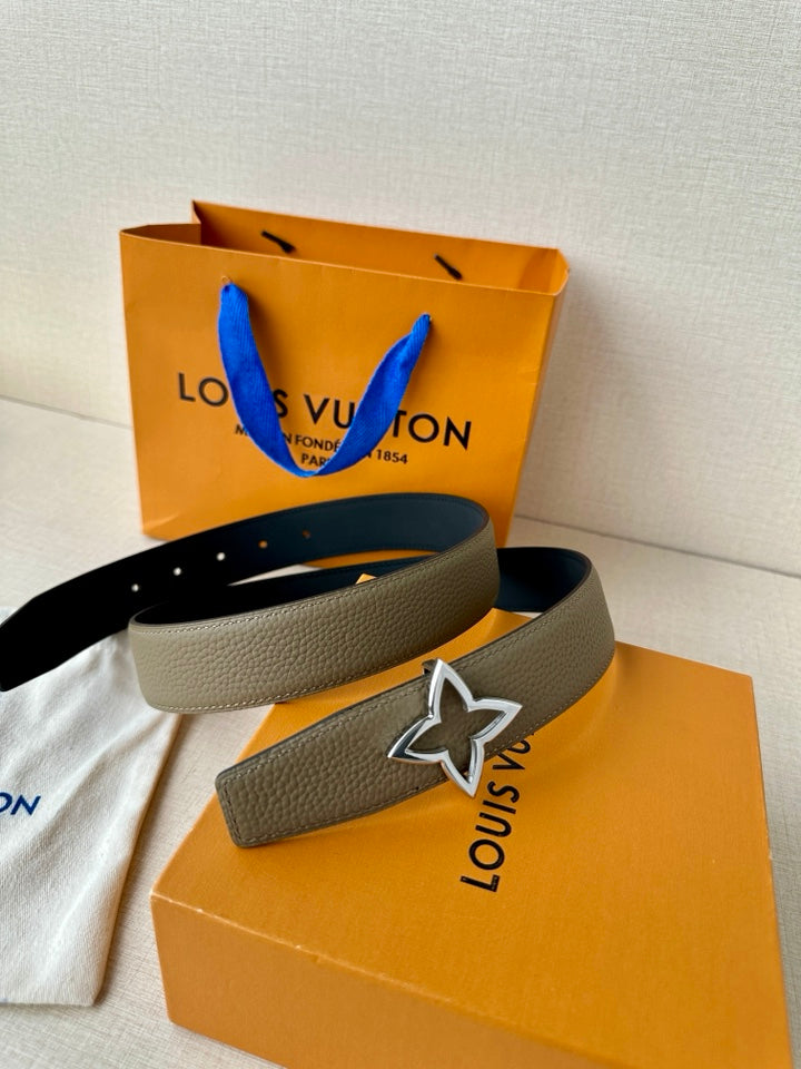 Louis Vuitton belt with light gray textured strap and silver star buckle