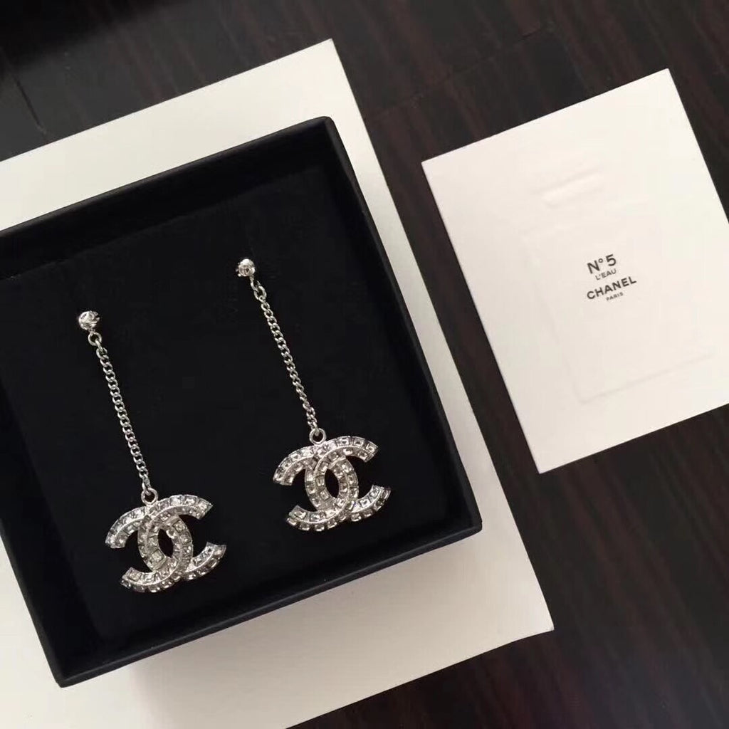 Chanel logo rhinestone drop earrings with silver-tone chains, pair view