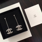 Chanel logo rhinestone drop earrings with silver-tone chains, pair view