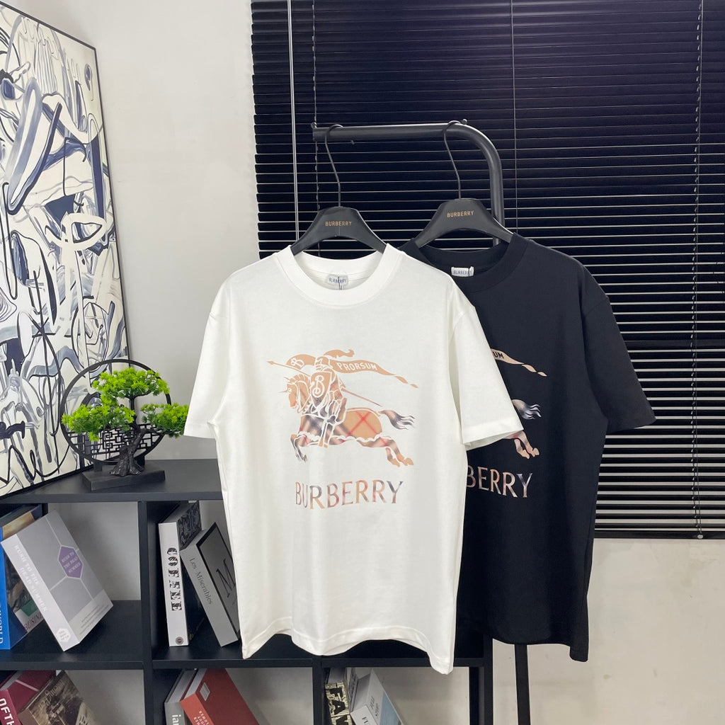 Crew-neck graphic T-shirts on hangers, white and dark with Burberry lettering