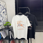 Crew-neck graphic T-shirts on hangers, white and dark with Burberry lettering