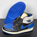 High-top sneakers on outsole: black and blue leather upper with white collar panel, cream midsole