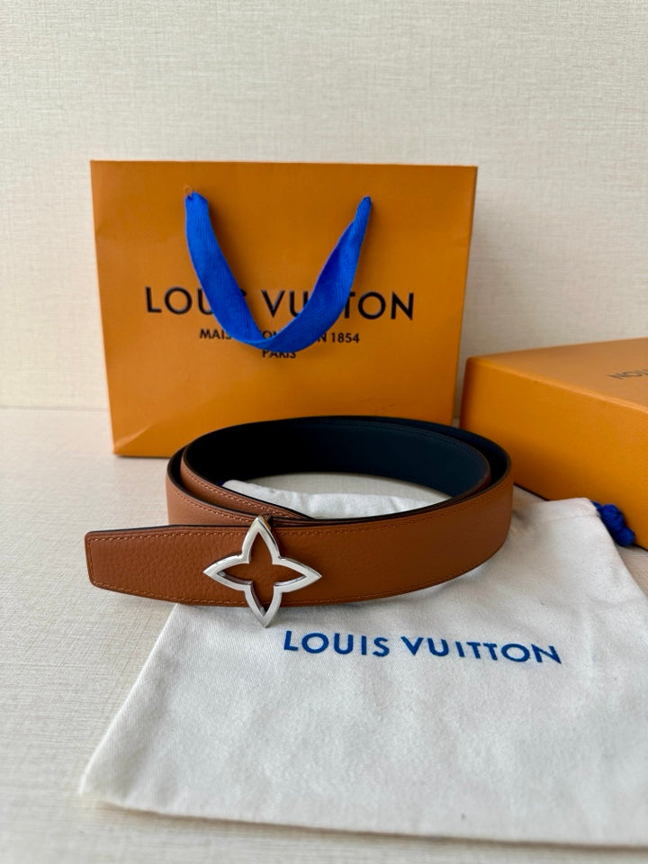 Tan leather Louis Vuitton belt with dark navy star buckle and matching pouch