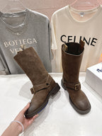 Burberry brown suede buckle tall boots, held hand showing side strap and buckle