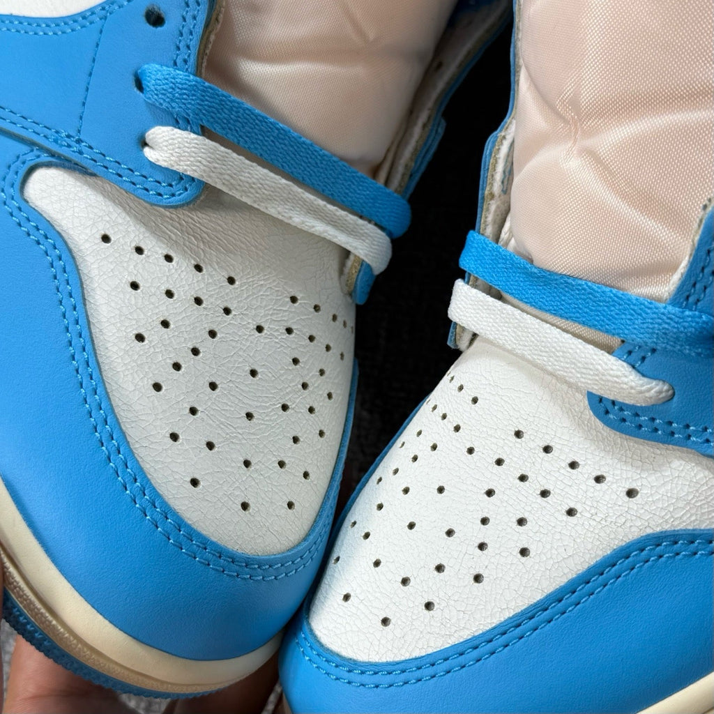 Air Jordan 1 Retro High OG sneakers, close-up perforated toe box in white and blue
